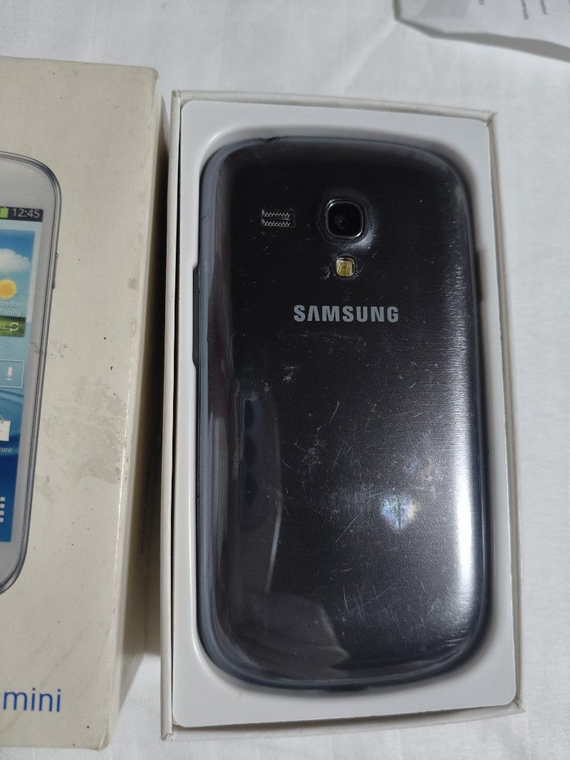 Samsung Galaxy S III Mini (Category: Samsung) located in Paranaque City. Submitted by momofaa (Listing ID 1470926518, Image 3). Description: - Brand/Model: Samsung Galaxy S3 Mini (GT-I8190) - Includes original product box - Compact design that fits easily in the hand or pocket - Pre-loved condition with visible standard wear on the body - Perfect reliable option for a secondary device or basic daily use Globe locked.