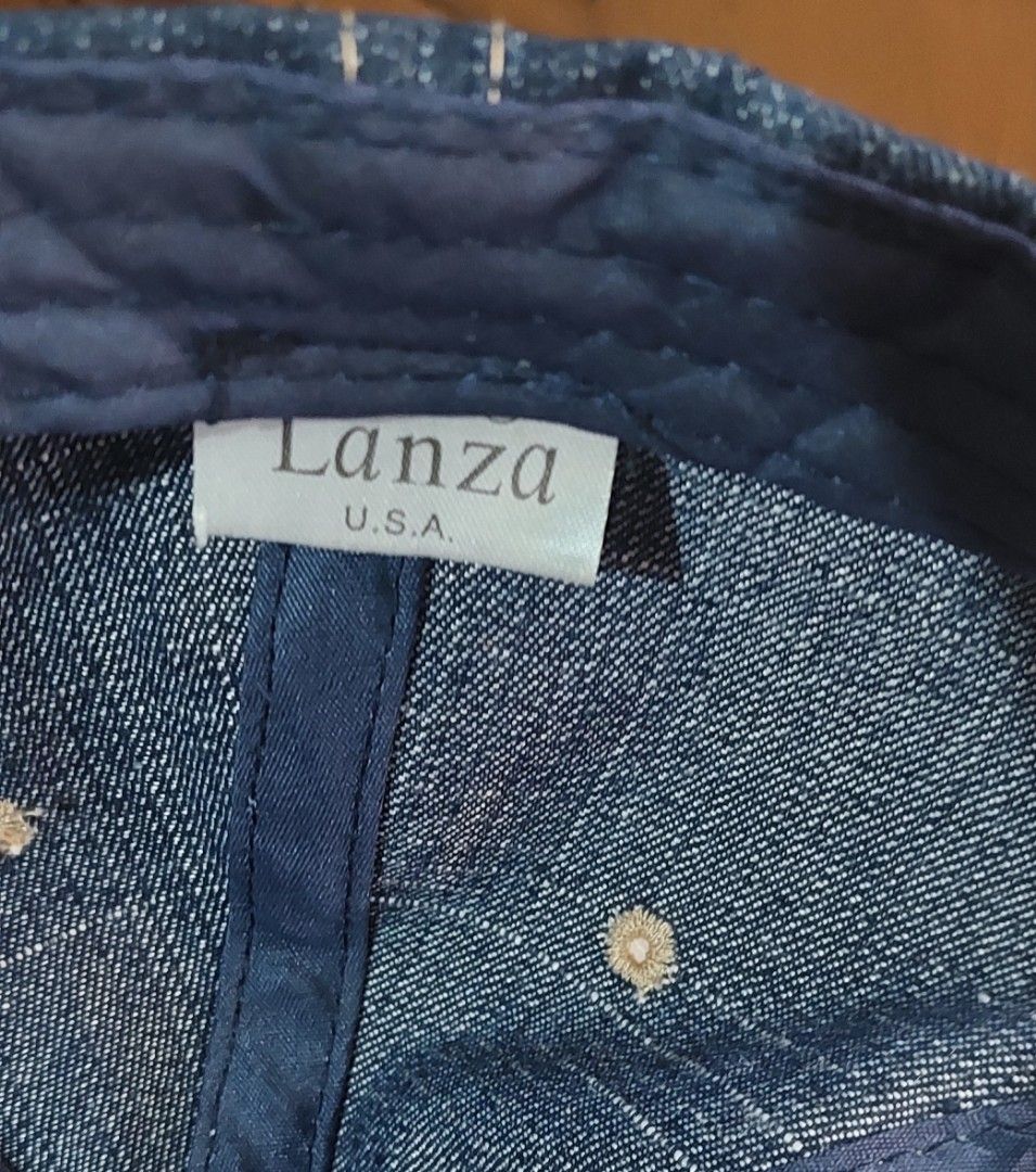 San Francisco Denim Baseball Cap (Category: Caps & Hats) located in Baguio. Submitted by ayra1523 (Listing ID 1470768707, Image 2). Description: - Brand: Lanza U.S.A. - Material: Dark denim with contrast stitching - Design: San Francisco embroidery on front and brim - Detail: Oval leather patch with stamped SF logo - Fit: Adjustable strap at the back for a custom fit - Condition: Structured crown with clean white interior lining and original bran