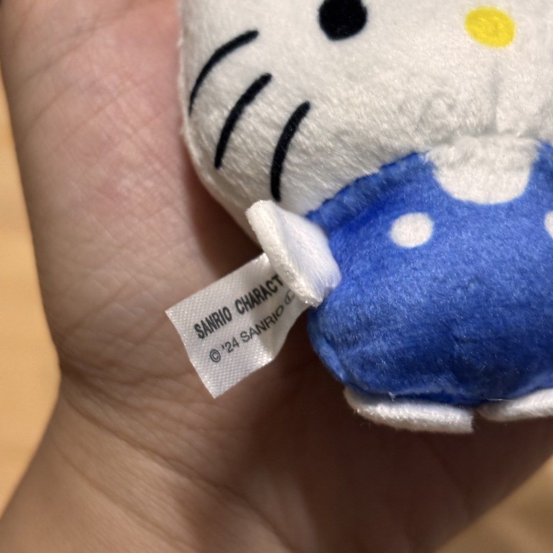 Sanrio Hello Kitty Blue Overalls Plush Keychain '24 (Category: Plushies & Soft Toys) located in Manila. Submitted by nero.ph (Listing ID 1470822945, Image 3). Description: - Authentic Sanrio '24 Kitty plush keychain - Features cute blue polka dot overalls and signature red bow - Equipped with a sturdy metal ball chain for easy attachment - Compact and handy for bags, keys, or lanyards.