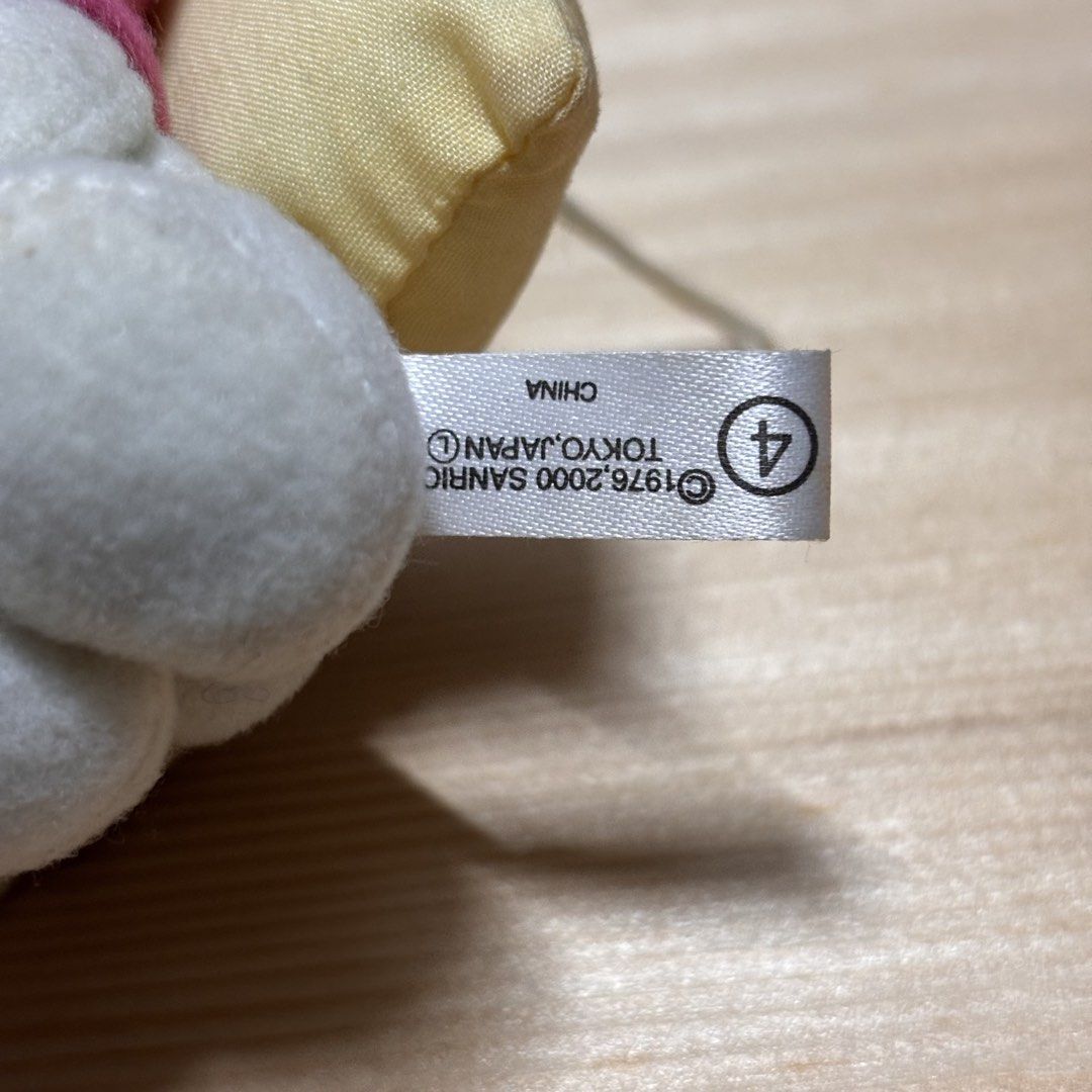 Sanrio My Melody Sleeping Plush Keychain (Category: Plushies & Soft Toys) located in Manila. Submitted by nero.ph (Listing ID 1470823191, Image 3). Description: - Authentic Sanrio My Melody plush mascot hanging charm - Features My Melody in a pink hood and white body resting on a tiny yellow pillow with a pink bow - Equipped with a white hanging loop string for bags, keys, or lanyards - Official vintage tag reads Sanrio copyright 1976, 2000, Toky