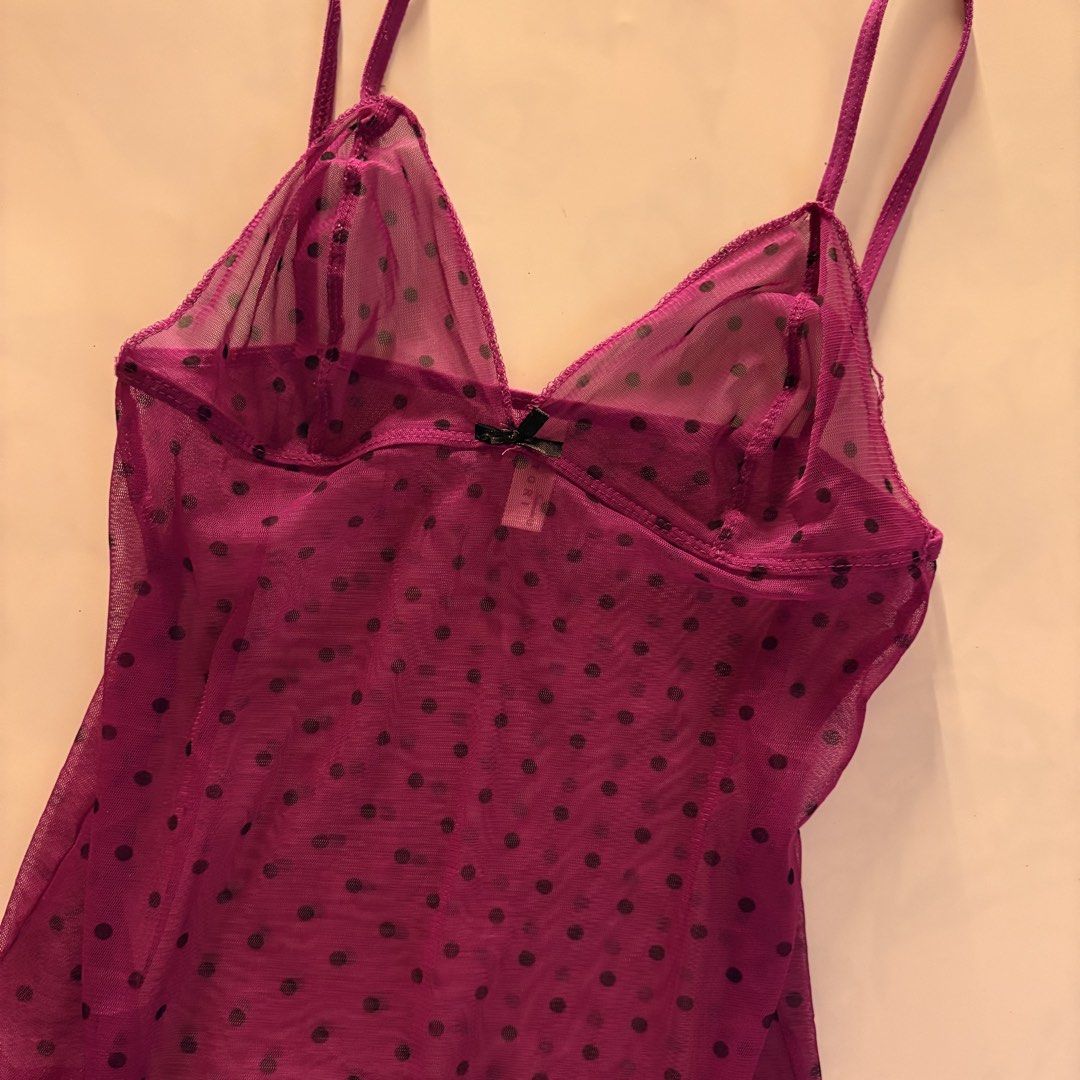 Satori Intimates Polka Dot Mesh Camisole Purple (Category: Sleeveless) located in Quezon City. Submitted by tomatoes221 (Listing ID 1470756711, Image 2). Description: - Brand: Satori Intimates - Design: Purple sheer mesh with all-over black polka dots - Details: Thin shoulder straps and sweet black bow at the front neckline - Styling: Great for layering or as a statement piece - Condition: Excellent / Like new - Shipping or Meetups available (PH)