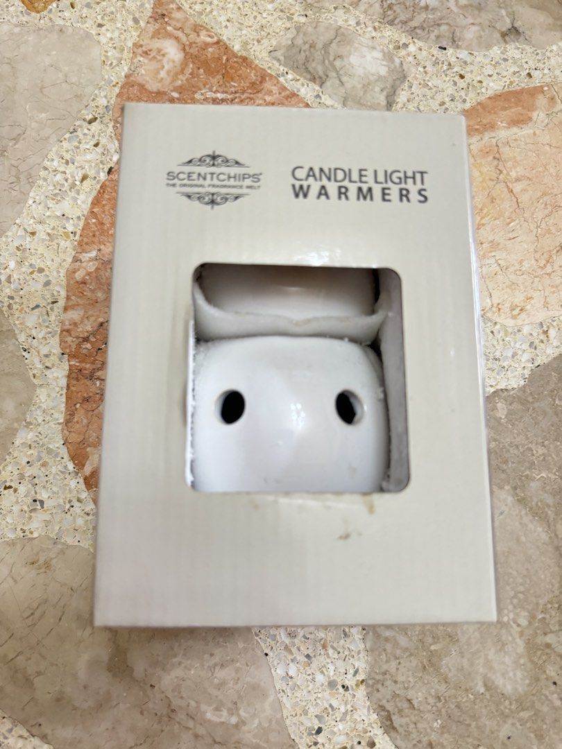 Scentchips Candle Light Warmers Owl Design (Category: Home Fragrance) located in Las Pinas. Submitted by emdjss (Listing ID 1470801390, Image 3). Description: - Scentchips Candle Light Warmer - Cute white ceramic owl design with light cutouts - Safely melts fragrance wax chips using a warm bulb - Original box included - Ideal for home fragrance enthusiasts.