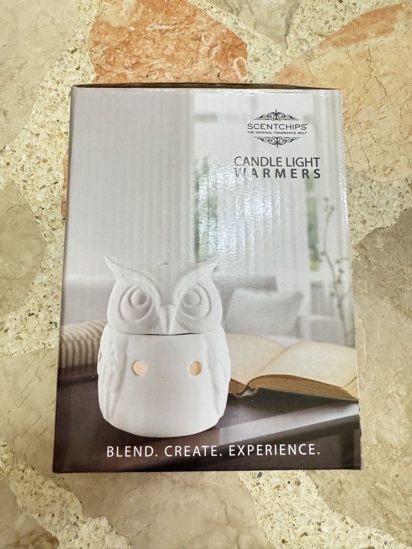 Scentchips Candle Light Warmers Owl Design (Category: Home Fragrance) located in Las Pinas. Submitted by emdjss (Listing ID 1470801390, Image 1). Description: - Scentchips Candle Light Warmer - Cute white ceramic owl design with light cutouts - Safely melts fragrance wax chips using a warm bulb - Original box included - Ideal for home fragrance enthusiasts.