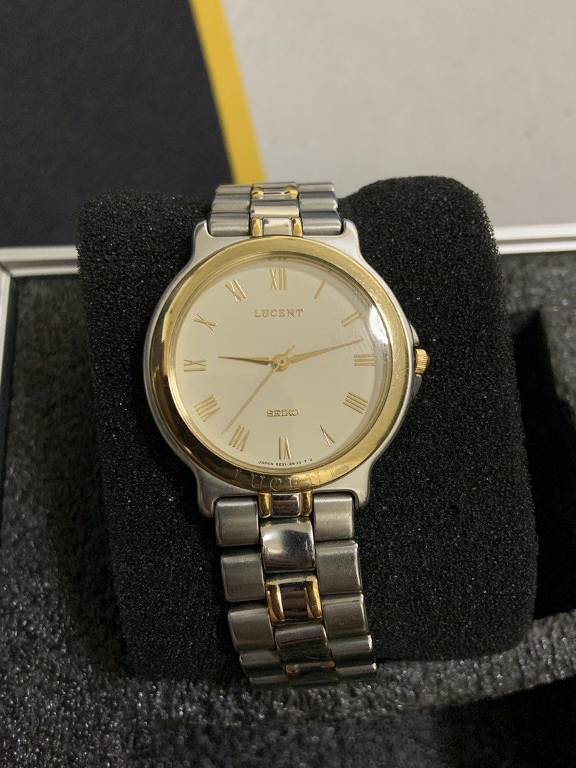 Seiko Lucent Two-Tone Watch (Category: Men's Watches) located in Manila. Submitted by relokado (Listing ID 1470869207, Image 1). Description: - Brand: Seiko Lucent - Movement: Quartz (runs well) - Design: Classic vintage look - Strap: Two-tone steel and gold bracelet - Dial: Cream with gold Roman numerals and hands - Bezel: Gold with engraved Lucent branding - Crown: Located on the right side.