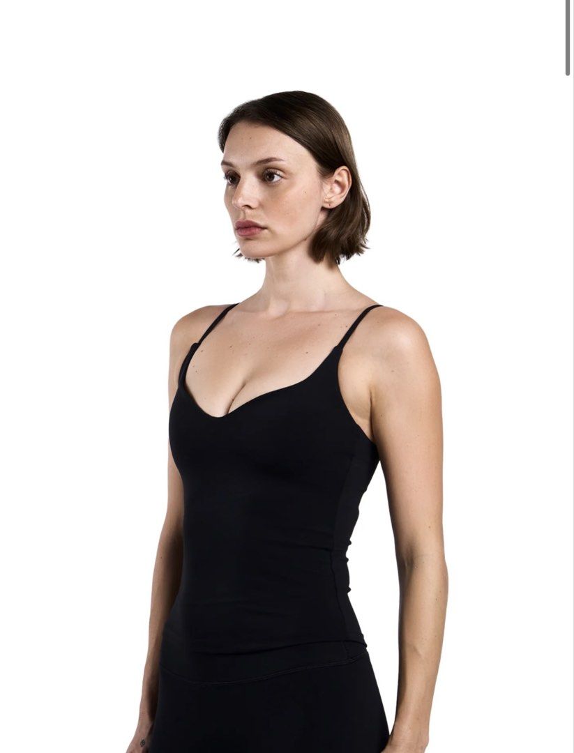 SHAPE Active Tone Curve SMALL Black (Category: Activewear) located in Manila. Submitted by yourownbrand (Listing ID 1470814697, Image 2). Description: Used 2x only Too small for me Like new SHAPE black camisole top in size S. Made from 80% polyester and 20% spandex material. Adjustable thin straps with metal hardware. V-neck cut at the front. Built-in support band underneath the bust. Plain black color, clean minimalist design..