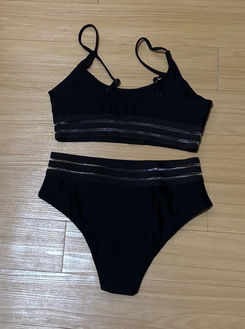 Shein Black Bikini Set Small - Medium (Category: Bikinis & Swimsuits) located in Quezon City. Submitted by garagesale2026 (Listing ID 1470785855, Image 2). Description: - Color: Classic black - Style: Two-piece bikini set with crop top and high-waisted bottoms - Straps: Adjustable spaghetti straps for a custom fit - Details: Chic sheer mesh stripe cutouts on top and bottoms - Ideal for: Beach days, pool parties, and vacations.