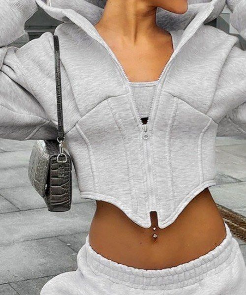 Shein Grey Corset Hoodie Cropped Jacket (Category: Coats, Jackets and Outerwear) located in Manila. Submitted by dianafayesimbre (Listing ID 1470814893, Image 2). Description: - Grey zip-up hoodie with front zipper closure - Trendy corset-style waist with a cropped fit - Long sleeves and attached hood - Soft and cozy fleece lining inside - Size: Teen 13Y on tag but can fit xxs to small - Great basic piece for everyday layering.