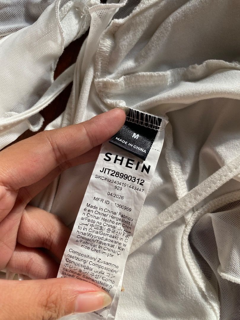SHEIN MOD White Halter Ruffle Lace Up Top (Category: Sleeveless) located in Pateros City. Submitted by strawberhyun (Listing ID 1470814181, Image 2). Description: - Brand: SHEIN Mod - Size: M (Medium) - Color: White - Condition: Brand new with tags (never worn) - Material: Lightweight polyester blend, sheer mesh texture - Details: Ruffle trim on neckline and hem, adjustable lace-up front with long ties Used once only!.