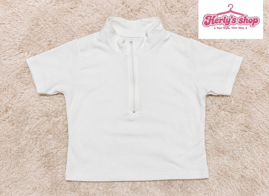 Short top - White Ribbed Half Zip Crop Top Short Sleeve (Category: Shirts) located in Quezon City. Submitted by herlys.684 (Listing ID 1470880408, Image 1). Description: 📏Size: M to L 📍 Loc: Qc 🚚Delivery: lalamove 📌 Meet up: SM Fairview - Color: White - Style: Ribbed crop top with short sleeves and half-zip collar - Fabric: Textured, highly stretchy, and comfortable - Condition: Clean, well-maintained - Pairing: Perfect with high-waisted jean