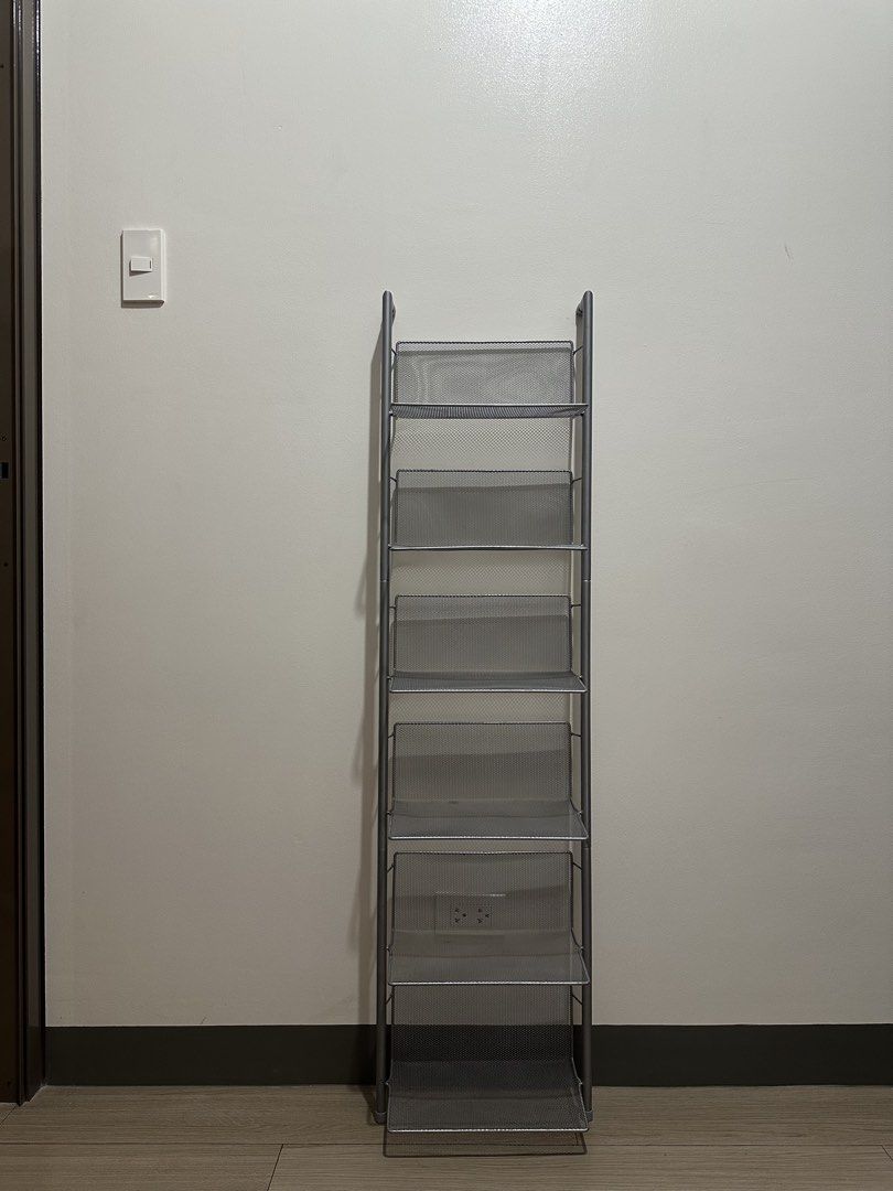 Silver 6-Tier Metal Mesh Shelf Rack (Category: Shelves, Cabinets & Racks) located in Mandaluyong City. Submitted by lexterrr (Listing ID 1470904788, Image 1). Description: Bought from another shop for P1,500. Used and in good condition. Selling because I am decluttering and no longer need it. Details: * 6-tier shelf rack * Silver metal mesh finish * Dimensions: approximately 135cm H x 34cm W x 30.8cm D * Slim design, suitable for small spaces * C
