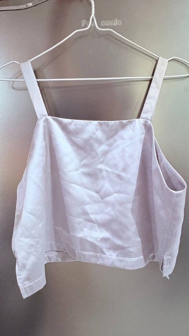 Silver gray Satin Crop Top with Button Strap Details (Category: Sleeveless) located in Manila. Submitted by jaysieseva620 (Listing ID 1470827676, Image 2). Description: - Color: Silver gray - Material: Lightweight satin-like fabric - Neckline: V-neck front with a chic square back - Details: Wide straps with cute decorative front buttons - Fit: Cropped length with a straight hem - Condition: Brand new / Excellent (ready to wear) - Perfect for: Cas
