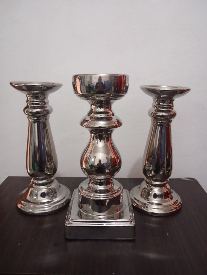 Silver porcelain candle holder (Category: Vases & Decorative Bowls) located in Las Pinas. Submitted by quick_deals_great_finds2 (Listing ID 1470828471, Image 1). Description: Good condition 11 inches tall.