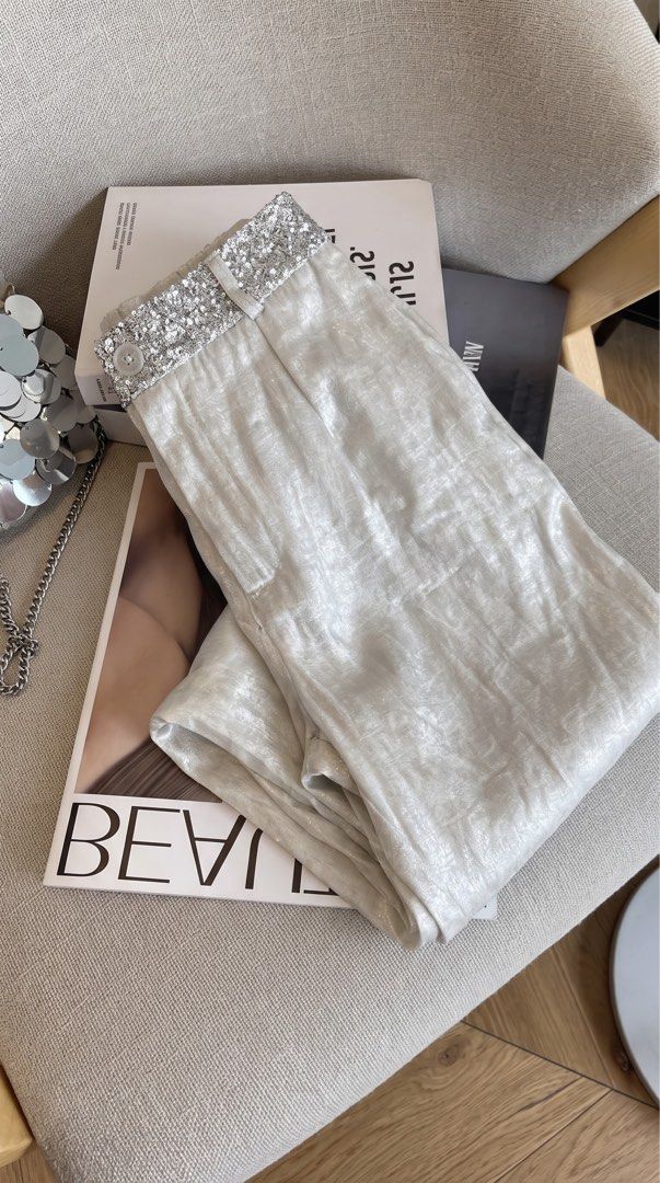 Silver Sequin High Waist Wide Leg Pants (Category: Jeans) located in Taguig. Submitted by kawushii (Listing ID 1470786656, Image 2). Description: - Color: Silver metallic - Style: Wide leg with pleated front - Waistband: Sparkly sequin detail, button closure, and belt loops - Material: Lightweight, flowy, and catches the light nicely - Occasion: Perfect statement piece for parties and evening events - Pairing tip: Looks amazing with simple tops o