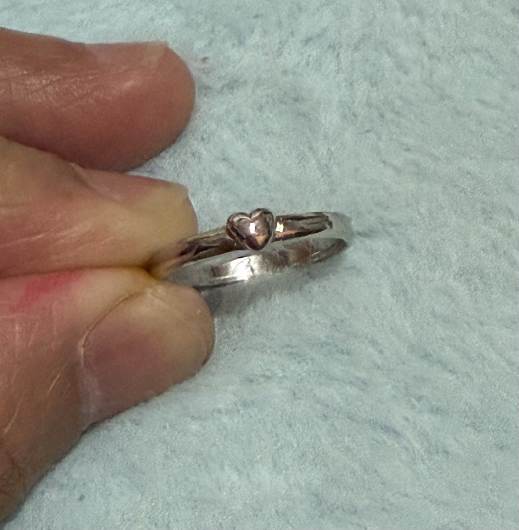 Silver tone Ring with Small Heart Charm Size 6 (Category: Rings) located in Mandaue City. Submitted by chuchi152615 (Listing ID 1470919219, Image 1). Description: - Simple silver band with a cute tiny raised heart - Highly polished clean metal finish - Size: 6 - Lightweight and comfortable for daily wear - Great for stacking or wearing on its own - From a clean, smoke-free home.