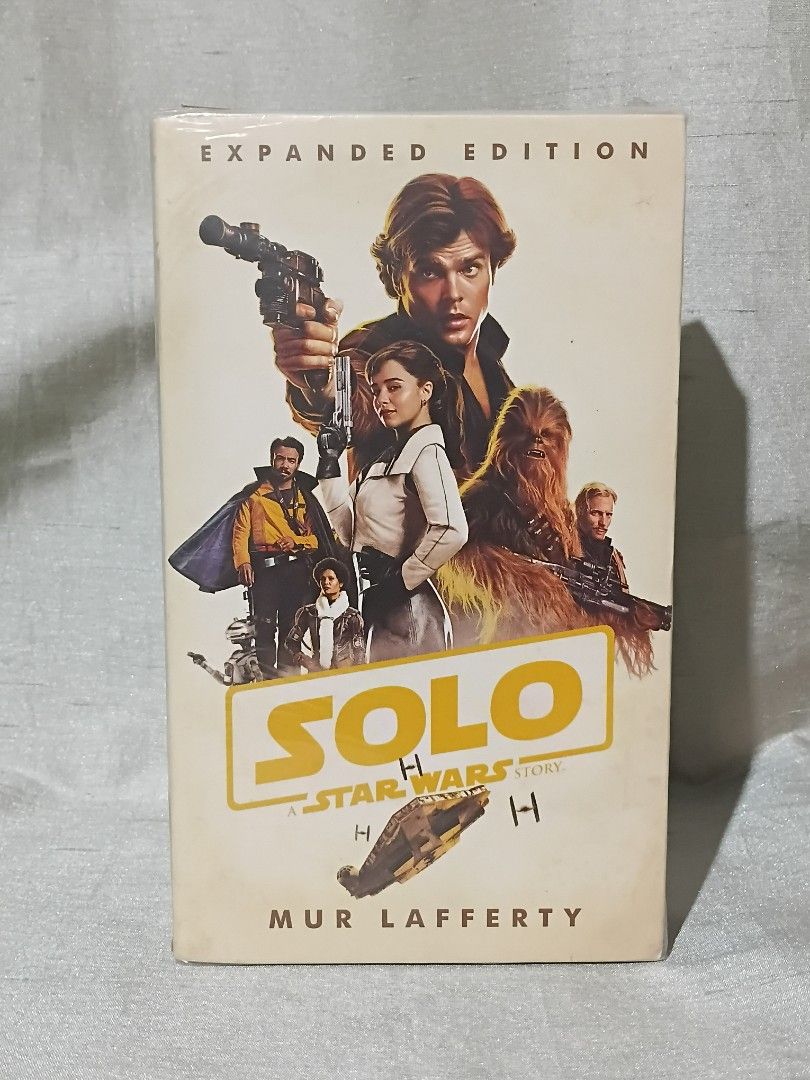 Solo: A Star Wars Story Expanded Edition by Mur Lafferty (Category: Storybooks) located in Manila. Submitted by krishna_ayanami (Listing ID 1470853905, Image 1). Description: - Title: Solo: A Star Wars Story Expanded Edition - Author: Mur Lafferty - Format: Paperback - Condition: Brand new, unread, and still sealed in original plastic - Features: Cover art includes Han Solo, Chewbacca, and Qi'ra.
