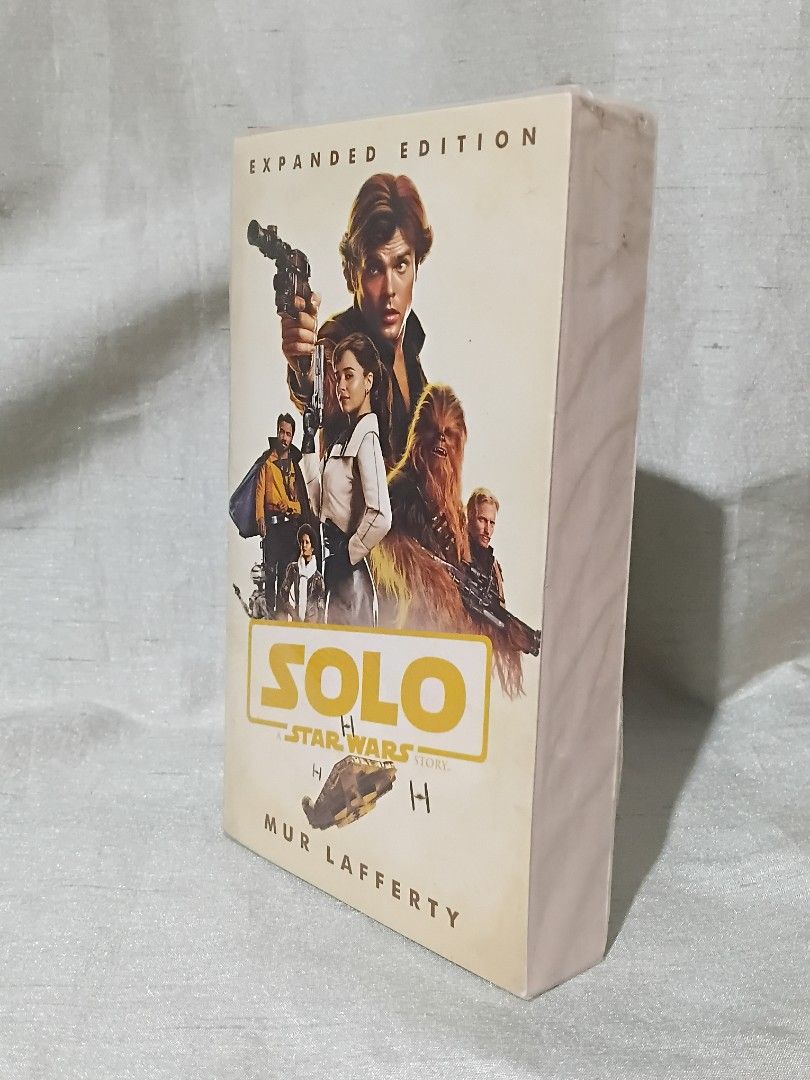 Solo: A Star Wars Story Expanded Edition by Mur Lafferty (Category: Storybooks) located in Manila. Submitted by krishna_ayanami (Listing ID 1470853905, Image 2). Description: - Title: Solo: A Star Wars Story Expanded Edition - Author: Mur Lafferty - Format: Paperback - Condition: Brand new, unread, and still sealed in original plastic - Features: Cover art includes Han Solo, Chewbacca, and Qi'ra.