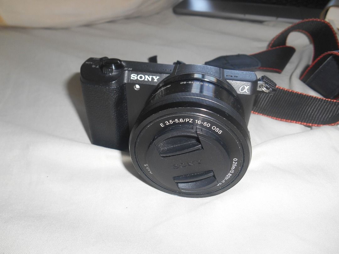 SONY a5100 Mirrorless Camera (Category: Cameras) located in Caloocan City. Submitted by shhye (Listing ID 1470788385, Image 2). Description: FINAL PRICE Inclusions: - Sony a5100 body - 16-50mm kit lens - Camera bag - Brand new strap - FREE 8GB SD card + Extra Battery - Charger (a bit faulty but still works, just letting you know upfront) RFS: Need funds, no longer using it .