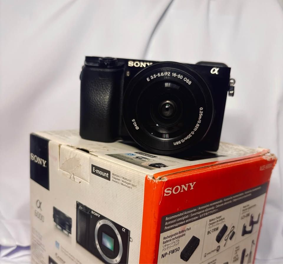 Sony A6000 Mirrorless Camera | 11k SC (Category: Cameras) located in Caloocan City. Submitted by svgstudios.shyrven (Listing ID 1470787221, Image 2). Description: - Model: Sony ILCE-6000 camera body with power zoom lens - Shutter Count: Very low at 11,888 actuations only - Resolution: 24.3 megapixels with AVCHD video recording - Display & Viewfinder: Tiltable LCD screen and EVF working perfectly - Condition: Clean battery compartment, undamaged b