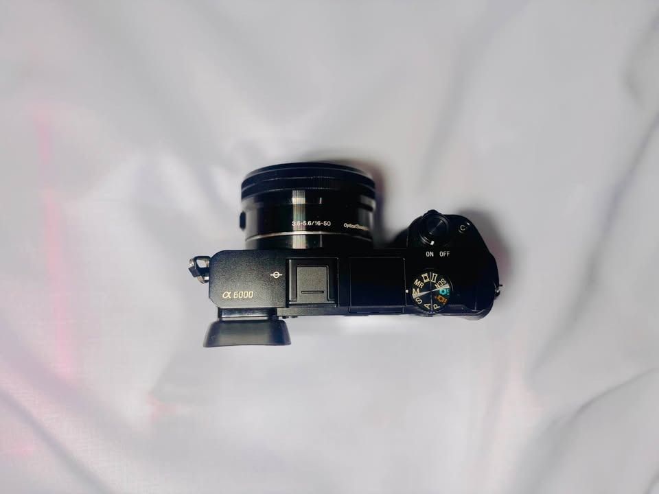 Sony A6000 Mirrorless Camera | 11k SC (Category: Cameras) located in Caloocan City. Submitted by svgstudios.shyrven (Listing ID 1470787221, Image 3). Description: - Model: Sony ILCE-6000 camera body with power zoom lens - Shutter Count: Very low at 11,888 actuations only - Resolution: 24.3 megapixels with AVCHD video recording - Display & Viewfinder: Tiltable LCD screen and EVF working perfectly - Condition: Clean battery compartment, undamaged b
