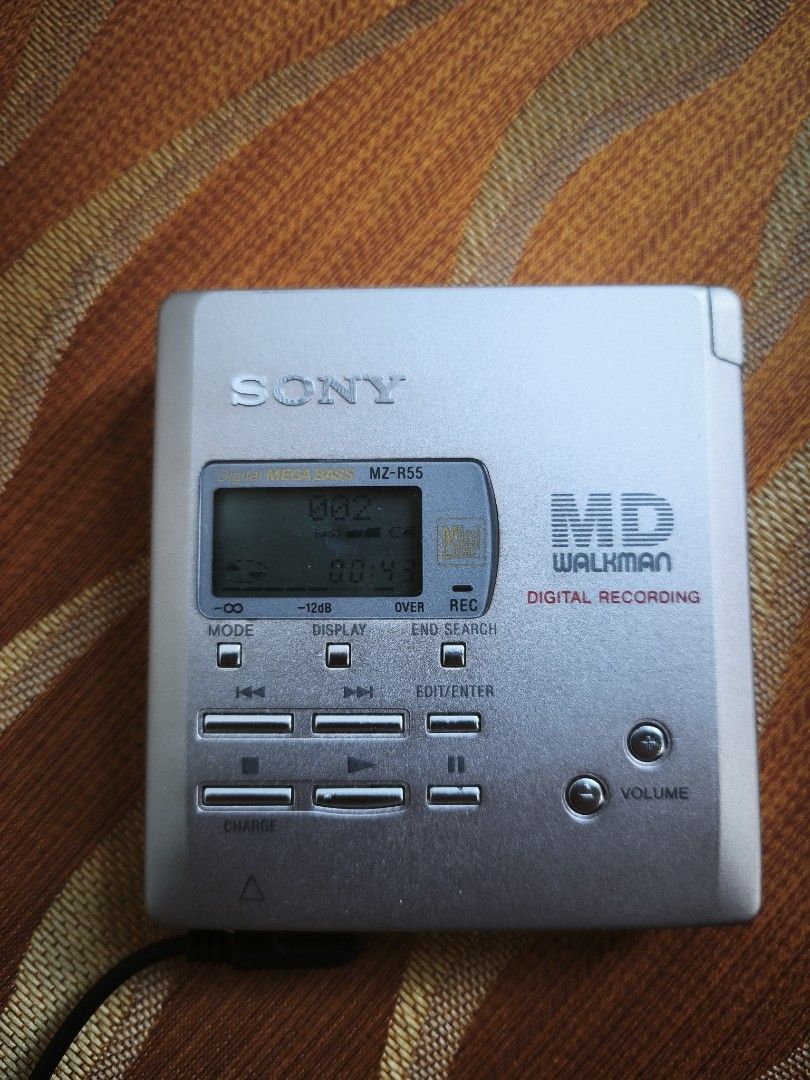 Sony Walkman MZ-R55 Portable MiniDisc (Category: Portable Music Players) located in Candon. Submitted by ylocos_thrifts (Listing ID 1470813713, Image 1). Description: Tested/Working Sony Walkman MZ-R55 Portable MiniDisc Remote/Headset is working Gum Battery Operated.