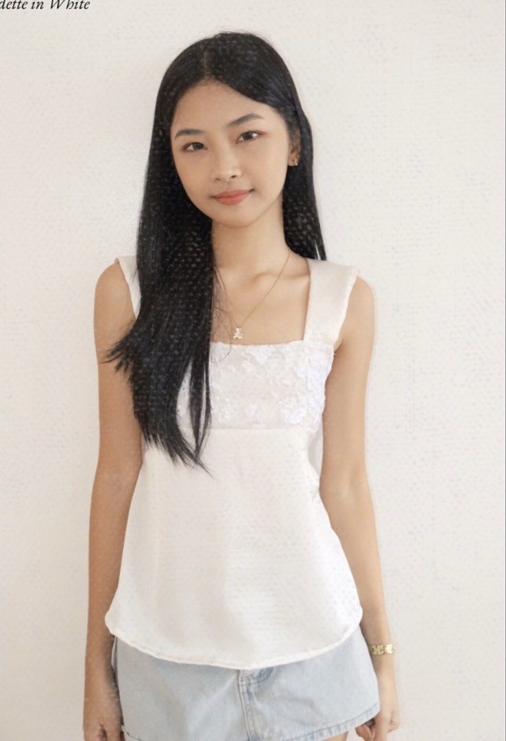 Sopheme Odette in White (Category: Sleeveless) located in Manila. Submitted by bellabells.619 (Listing ID 1470872730, Image 1). Description: - Brand: Sopheme - Model/Style: Odette - Color: White - Size: XS - Small (EU 34 / UK 6 / US 2) - Design: Sleeveless top with square neckline and delicate lace embroidery on the front bodice - Condition: Gently used, well-maintained - Perfect for casual outings, dates, or everyday wear RFS: used only for bran