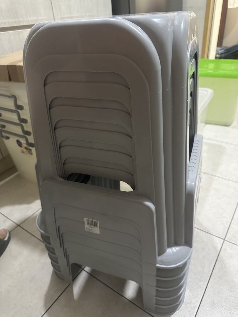 Stackable Grey Plastic Stools Set (Category: Chairs) located in Singapore. Submitted by chuanhock (Listing ID 1470778885, Image 1). Description: - Colour: Grey - Material: Sturdy plastic - Design: Space-saving stackable design with convenient backrest handle hole and ribbed leg details - Condition: Clean and ready to use - Ideal for: Extra seating around the house - total 6 pieces .