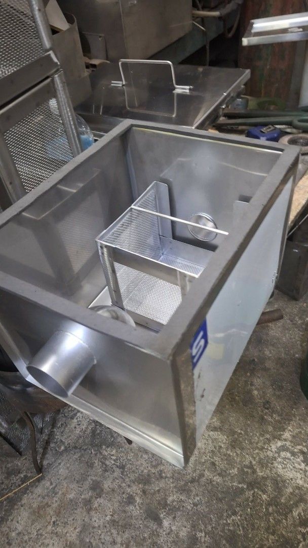 Stainless Steel Grease Trap for Kitchen Sink (Category: Bathroom & Kitchen Fixtures) located in Manila. Submitted by keencrystal.b88cf4 (Listing ID 1470744348, Image 3). Description: - Heavy-duty stainless steel construction - Includes internal filter basket and drainage pipes - Removable lid with a convenient metal handle - Prevents clogged plumbing for homes and restaurants - Solid, durable, and built to last.