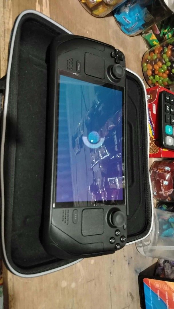 steamdeck oled 512gb (Category: Others) located in Rizal. Submitted by neeekkuuu (Listing ID 1470928855, Image 2). Description: - Item: Valve Steam Deck Handheld Console - Color: Black - Condition: Tested, turns on and loads up properly - Inclusions: Original charging adapter, protective case, protective grip shell, desktop dock, and box packaging - Perfect for: Portable PC gaming on the go.