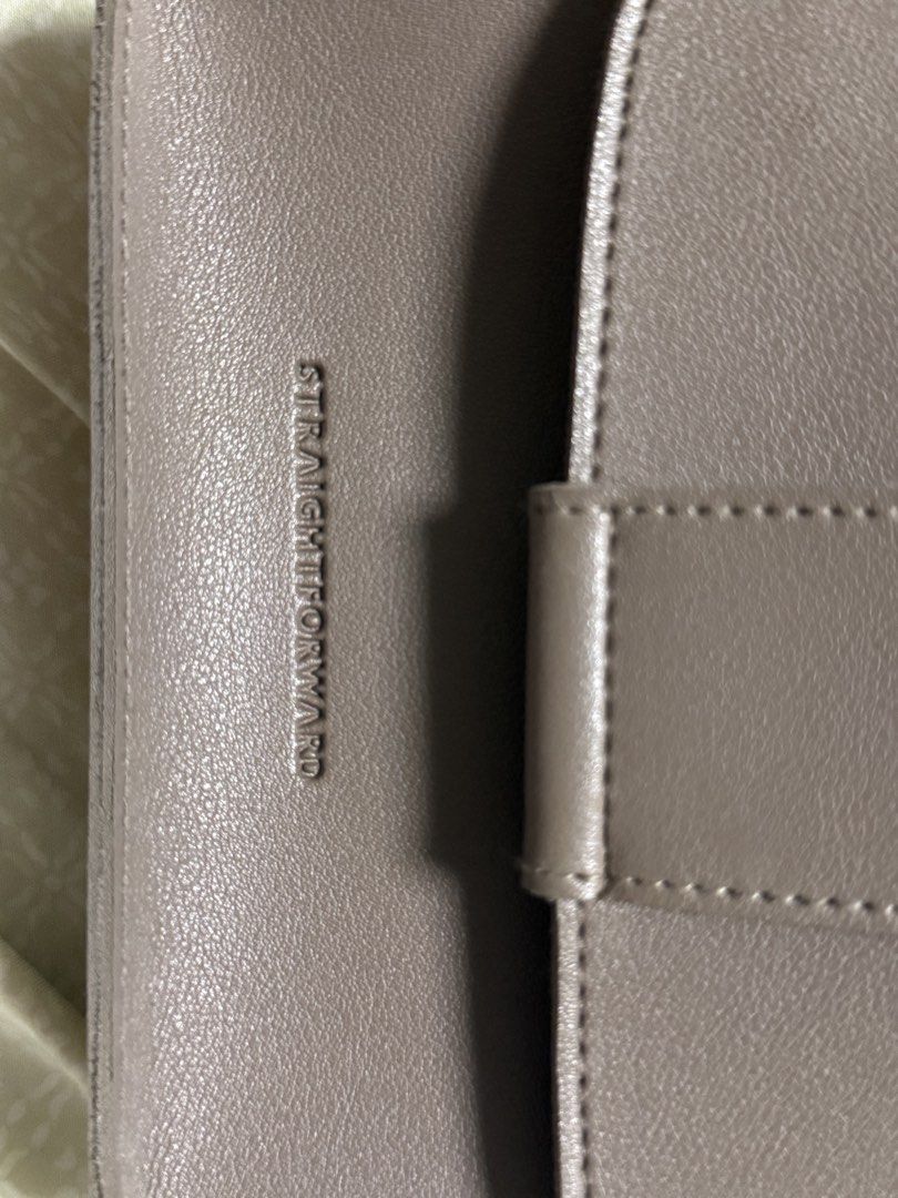 Straightforward Brown Crossbody Bag (Category: Cross-body Bags) located in Quezon City. Submitted by pattb (Listing ID 1470855772, Image 2). Description: - Brand: Straightforward - Style: Structured rectangular shoulder bag - Color: Brown - Closure: Front flap with magnetic snap - Hardware: Silver-tone with side ring attachments - Strap: Adjustable - Interior: Clean open compartment with suede-like lining - Details: Subtle debossed logo on the fr