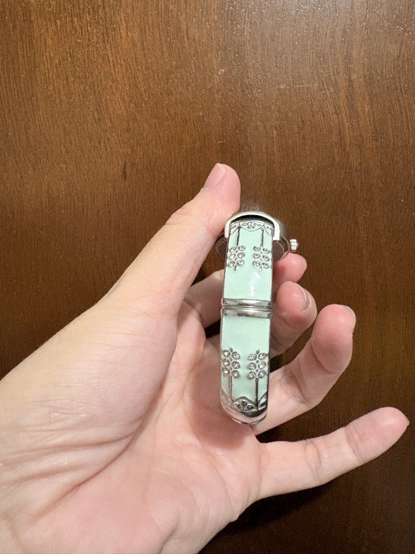 Studio Time quartz watch with mint green bangle strap (Category: Women's Watches) located in Mandaluyong City. Submitted by gentle.segoviajam (Listing ID 1470832448, Image 3). Description: Gorgeous mint green Studio Time watch with a crystal flower bangle strap and white oval dial. Battery-operated quartz movement, working perfectly. Great everyday accessory!.