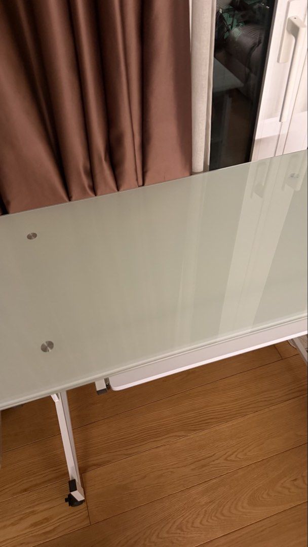 Study Table (Category: Tables & Sets) located in Makati City. Submitted by shopbb (Listing ID 1470877650, Image 2). Description: - Modern tempered glass top computer desk - Convenient pull-out keyboard shelf - Sturdy white metal frame with locking castor wheels for easy mobility - Built-in wire management holes on side panels to keep cords neat - Standard workstation size, ideal for any home office or study space.