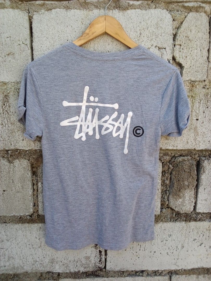 Stussy Gray T-Shirt Small (Category: Tshirts & Polo Shirts ) located in Dinalupihan. Submitted by yanyan.thirft (Listing ID 1470922082, Image 2). Description: - Brand: Stussy - Size: Small - Color: Grey - Design: Small chest logo & large signature back graphic - Details: Short sleeves with rolled cuffs, round neckline - Origin: Made in Mexico - Material: Lightweight, clean fabric - Style: Casual everyday streetwear.
