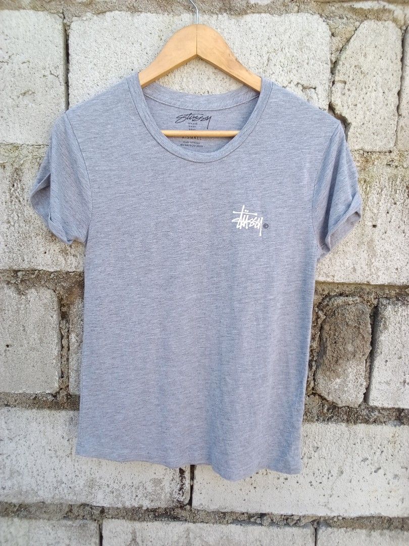 Stussy Gray T-Shirt Small (Category: Tshirts & Polo Shirts ) located in Dinalupihan. Submitted by yanyan.thirft (Listing ID 1470922082, Image 3). Description: - Brand: Stussy - Size: Small - Color: Grey - Design: Small chest logo & large signature back graphic - Details: Short sleeves with rolled cuffs, round neckline - Origin: Made in Mexico - Material: Lightweight, clean fabric - Style: Casual everyday streetwear.