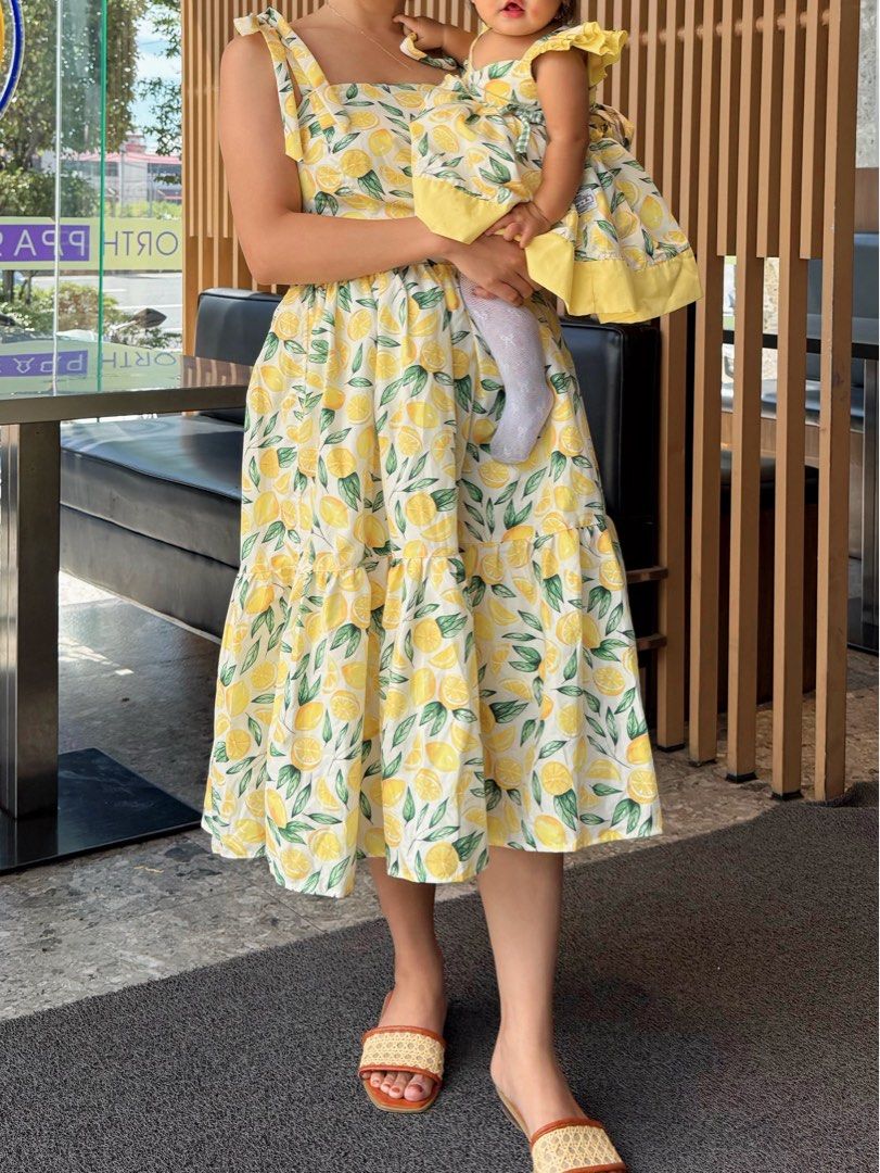 Summer Dress Lemon (Category: Dresses) located in Bulacan. Submitted by ForTheGramThrift (Listing ID 1470857279, Image 1). Description: - Mom dress avail - Bright yellow fabric with vibrant lemon print - Sleeveless design with comfortable wide straps - Playful tiered skirts - Perfect for sunny days and family matching outfits -From Hailey & Co -Used 1x -Original Price is 1500.