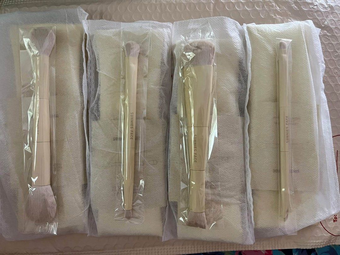 Sunnies Face Makeup Brush Set with Pouch (Category: Makeup) located in Manila. Submitted by preshyyyyy_ (Listing ID 1470843589, Image 2). Description: - Brand new Sunnies Face double-ended makeup brush set with original packaging - Set includes 4 versatile dual-ended brushes for a complete makeup routine - Crafted with ultra-soft synthetic bristles and chic neutral beige handles - Comes with individual protective cardboard sleeves for each brush 