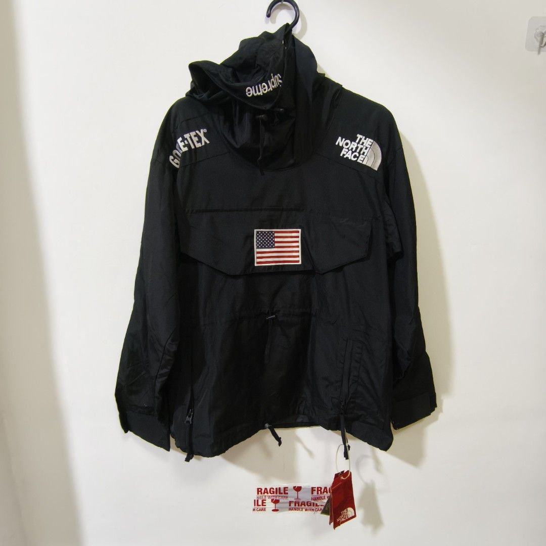 Supreme x The North Face Trans Antarctica Expedition Pullover Black (Category: Coats, Jackets and Outerwear) located in Quezon City. Submitted by inrelationthrift (Listing ID 1470814099, Image 1). Description: - Brand: Supreme x The North Face (Trans Antarctica Expedition Collection) - Color: Black - Material: Gore-Tex (100% waterproof) - Features: USA flag patches on front and back, Antarctica patch on right sleeve, and Supreme branding on hood 