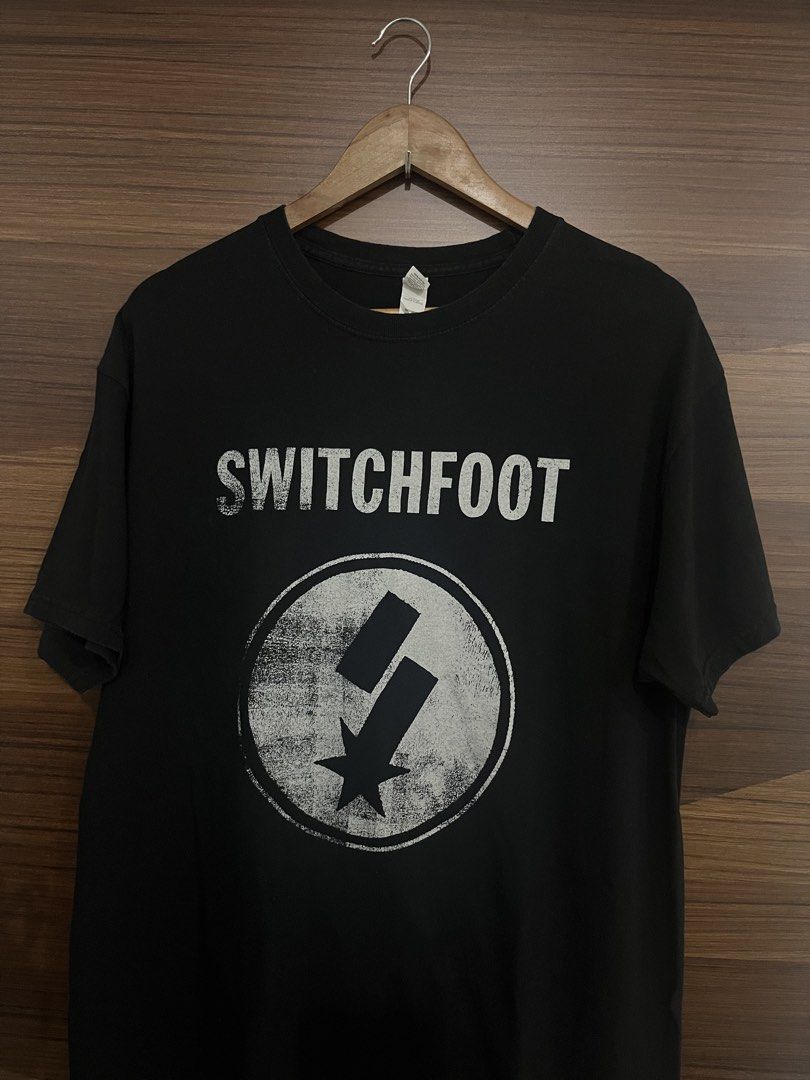 Switchfoot Band Black T-Shirt (Category: Tshirts & Polo Shirts ) located in Manila. Submitted by thrifted.shits (Listing ID 1470873926, Image 2). Description: 22.5x29 Excellent condi Size large on tag M&O gold - Official Switchfoot merchandise t-shirt - Classic black color made from comfortable 100% cotton - Features iconic band logo and star graphic on the chest - Regular fit with crew neck and short sleeves - Perfect addition to any alternative