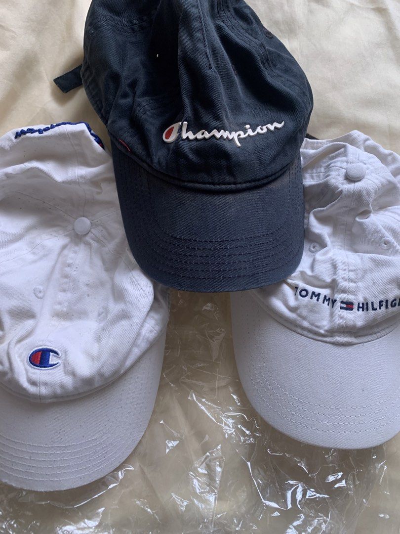 Take all Champion and Tommy Hilfiger Caps Bundle (Category: Caps & Hats) located in Bulacan. Submitted by heartlove_holb (Listing ID 1470825176, Image 2). Description: - Set of 3 trendy dad caps for daily streetwear - Black Champion hat featuring raised lettering - White Champion hat with embroidered logo - White Tommy Hilfiger hat with embroidered text - Classic curved brim design on all three - Convenient adjustable strapback closure for a cust