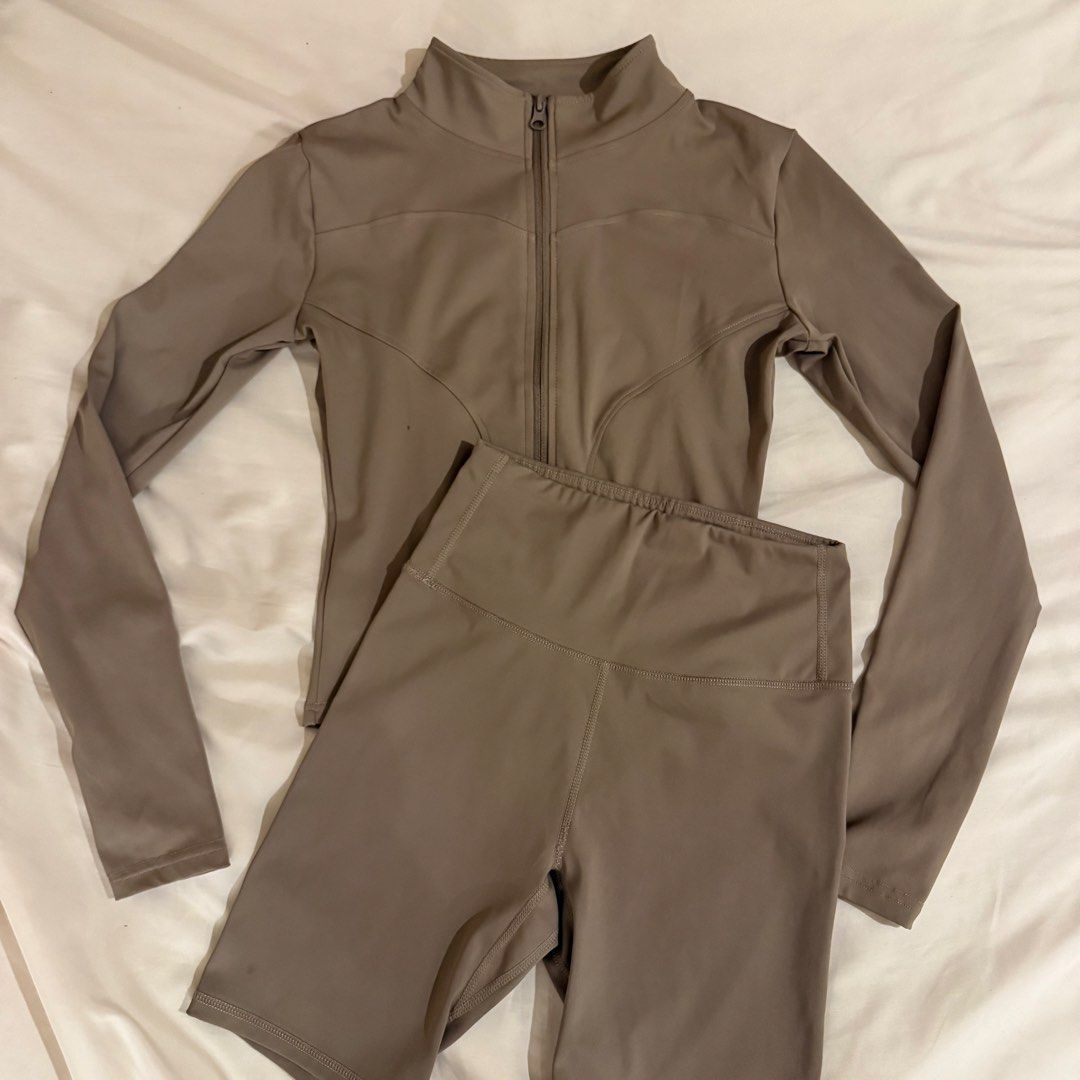 Taupe Activewear Set Zip Jacket and Shorts (Category: Activewear) located in Quezon City. Submitted by s0l4nge (Listing ID 1470885585, Image 1). Description: - Matching athletic set in versatile taupe - Includes long-sleeve full-zip jacket with mock neck - High-waisted biker shorts included - Smooth and stretchy material for maximum comfort - Ideal for workouts, gym sessions, or casual lounging - Excellent clean condition with no tears or stains.