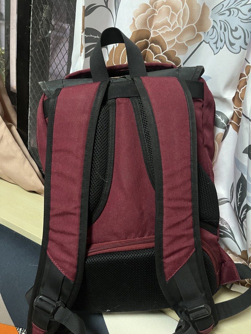 Technopack Maroon and Black Backpack (Category: Backpacks) located in General Trias. Submitted by walterwhiteyo (Listing ID 1470776161, Image 3). Description: - Color: Maroon with black flap cover - Brand: Technopack metal badge - Design: Dual buckle straps and smooth zippers - Comfort: Padded shoulder straps and mesh back panel - Interior: Multiple compartments with branded lining .