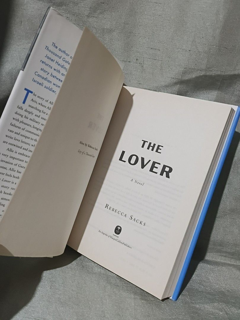 The Lover by Rebecca Sacks Novel (Category: Storybooks) located in Manila. Submitted by krishna_ayanami (Listing ID 1470852673, Image 2). Description: - Title: The Lover by Rebecca Sacks - Format: Hardcover fiction - Condition: Good, read once and kept on shelf - Appearance: Striking B&W photographic dust jacket with blue lettering - Interior: Clean pages throughout - Perfect for: Contemporary fiction fans and book collectors.