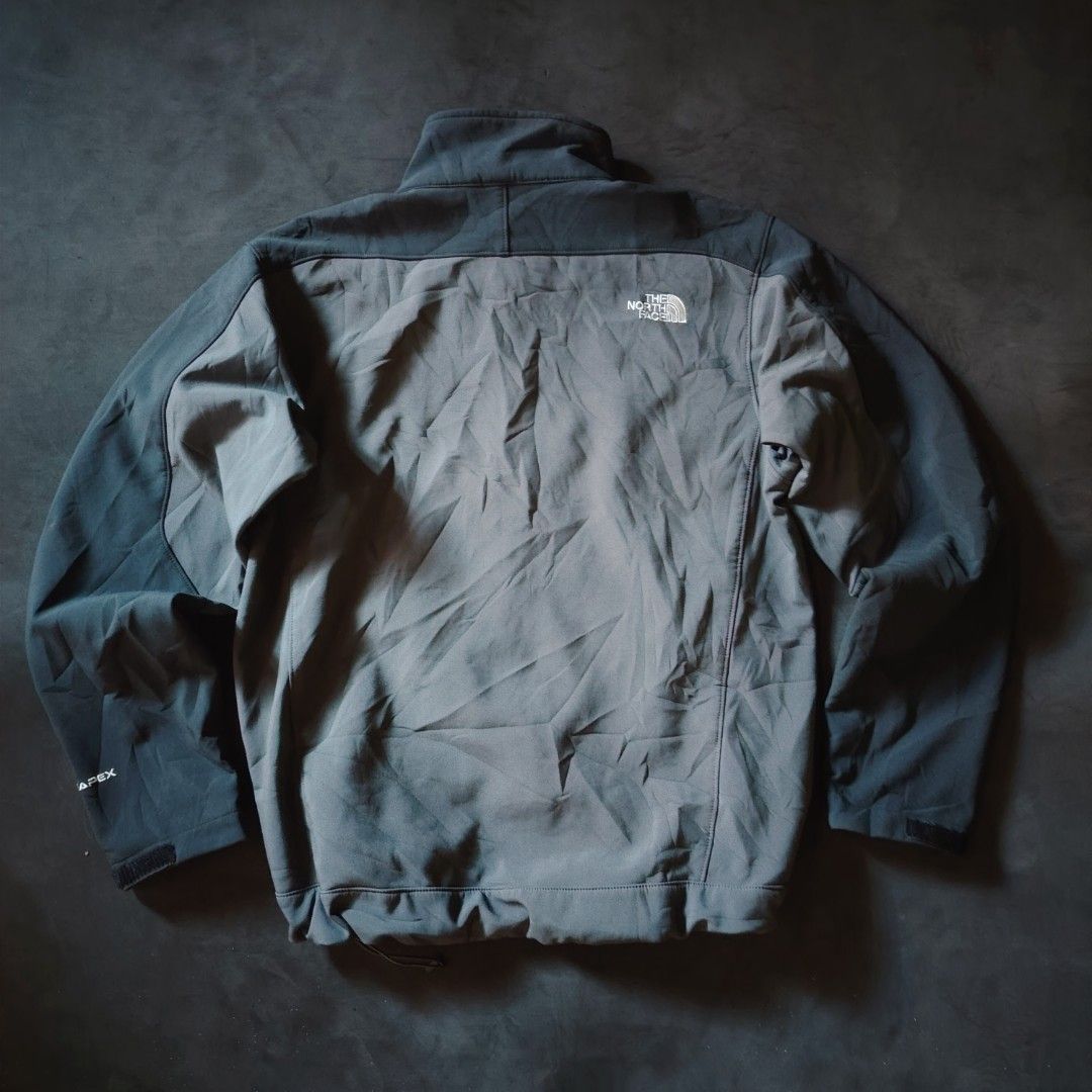 The North Face TNF Apex Softshell Jacket Grey (Category: Coats, Jackets and Outerwear) located in General Santos City (Dadiangas). Submitted by angelodemegilloceballos (Listing ID 1470754738, Image 3). Description: - Brand: The North Face - Style: TNF Apex Softshell Jacket - Color: Dark Grey & Charcoal - Closure: Full zip with stand-up collar - Pockets: 1 chest zip pocket, 2 lower zip hand pockets - Fit & Adjustability: Velcro cuffs and hem drawc