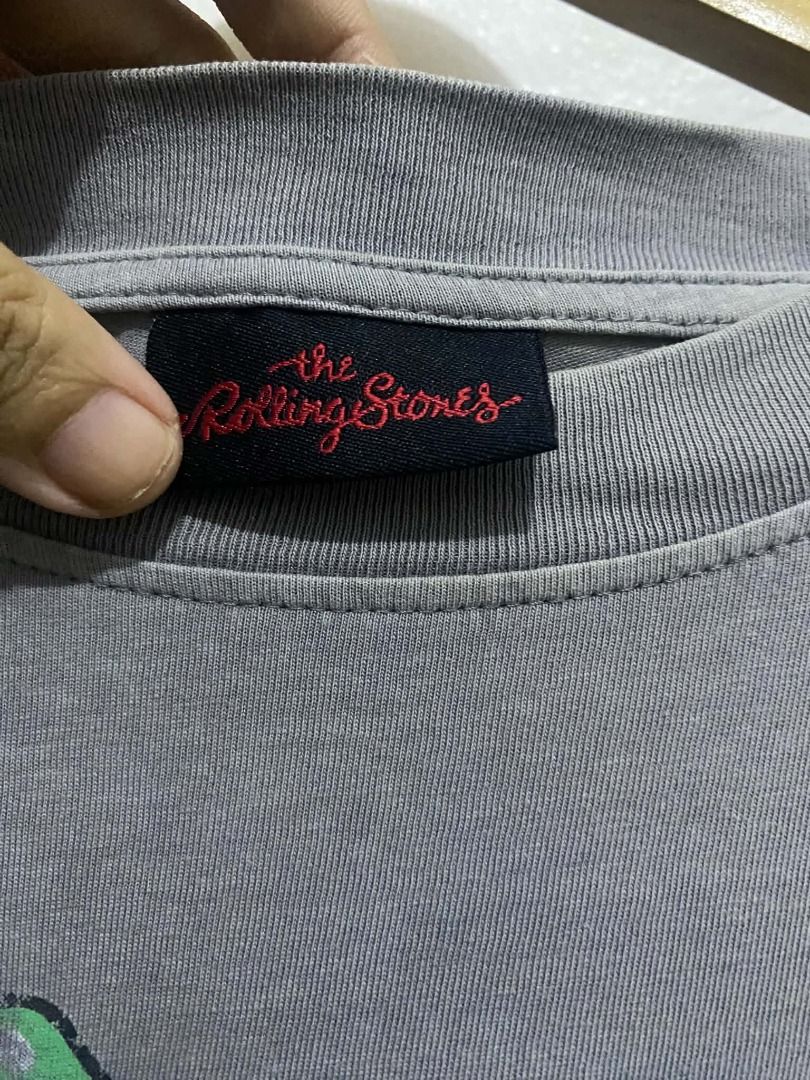 The Rolling Stones Graphic T-Shirt (Category: Tshirts & Polo Shirts ) located in Manila. Submitted by irespectthehustle (Listing ID 1470831948, Image 2). Description: - Official 2022 Musidor B.V. merchandise licensed by Bravado Merchandising - Larfe - Cool multicolored tongue logo spiral graphic on the front - Color: Classic grey short-sleeve crew neck - Material: Super soft 100% cotton with a comfortable relaxed fit - Details: Features original 