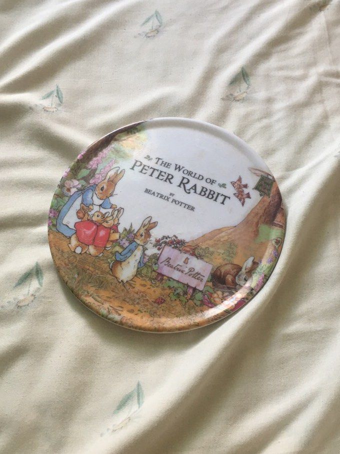 The World of Peter Rabbit Vintage Ceramic Plate Decor (Category: Dinnerware & Cutlery) located in Cabuyao City. Submitted by 4everblooms (Listing ID 1470783965, Image 1). Description: - Smooth glazed white finish with a raised circular base and embossed logo stamp - Ideal as a decorative display piece or for a kid's room.