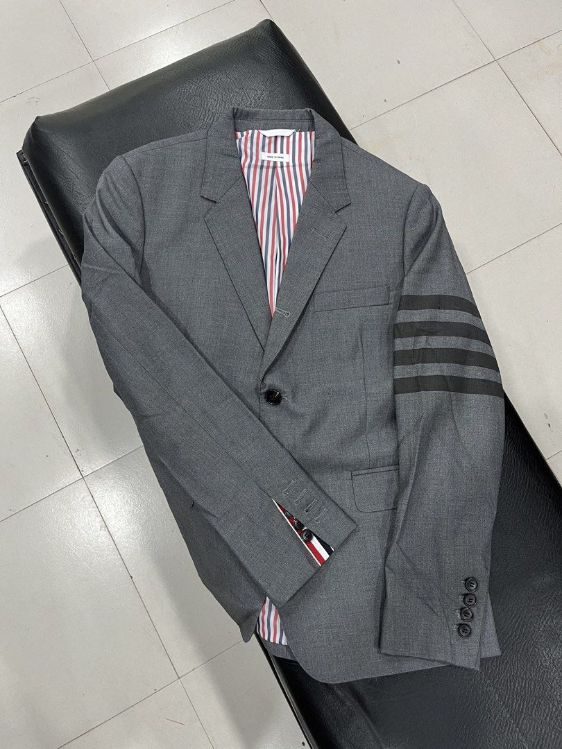 Thom Browne 4 Bar Blazer (Category: Coats, Jackets and Outerwear) located in Manila. Submitted by pure.ayoyyysss (Listing ID 1470794667, Image 1). Description: Thom Browne 4 Bar Blazer Sz1 Width: 19 Width : 27 Sleeve 24 Execellent No issue 5k free sf .