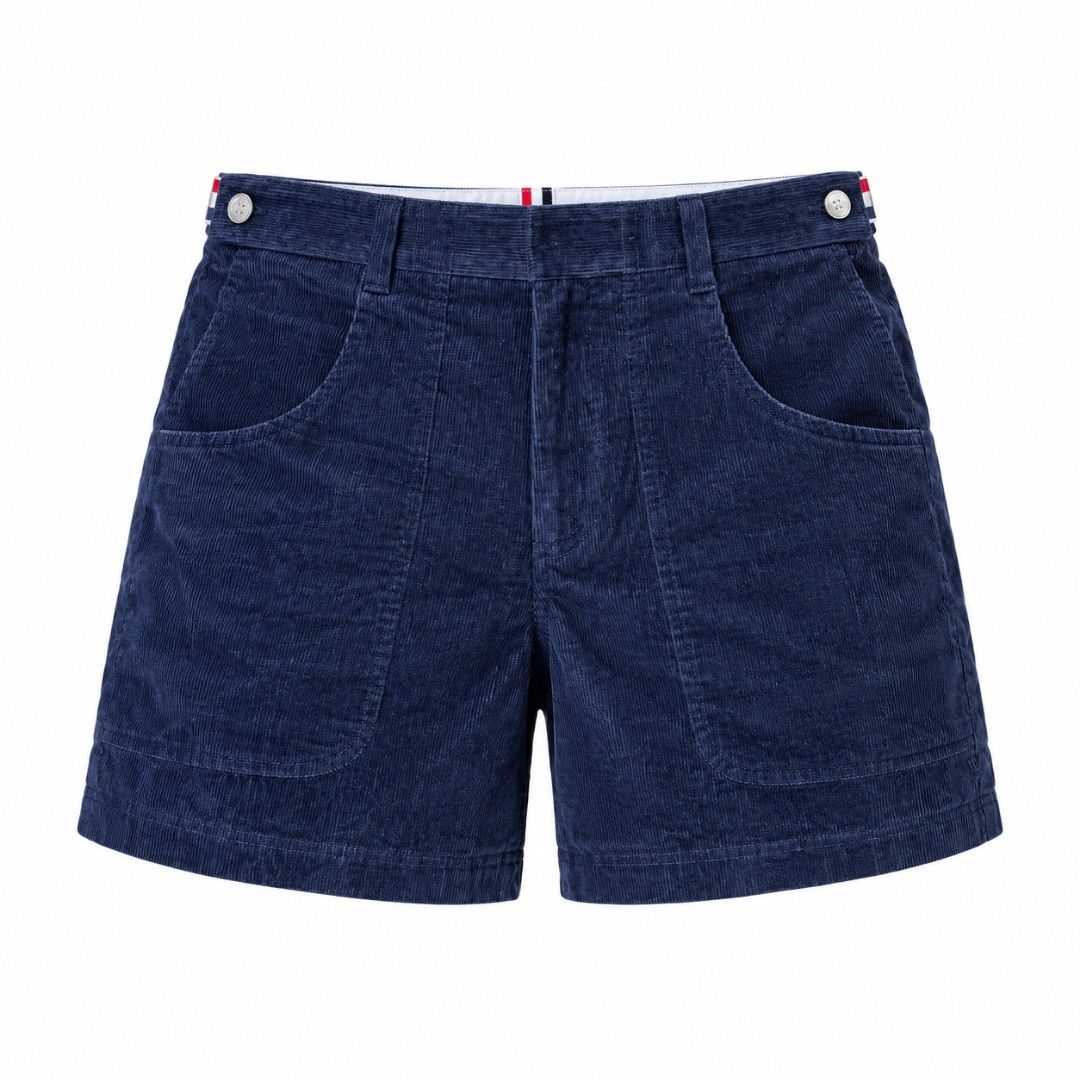 Thom Browne Navy Corduroy Shorts Size 1 (Category: Shorts) located in Manila. Submitted by yaot_archive (Listing ID 1468977523, Image 2). Description: - Brand: Thom Browne - Color: Navy Blue - Material: 100% Cotton corduroy, soft ribbed texture - Origin: Made in Japan - Size: Tagged Size 1 - Details: Classic tri-color grosgrain loop tab at back waist, button side adjusters, front and back patch pockets - Condition: High-quality construction with 