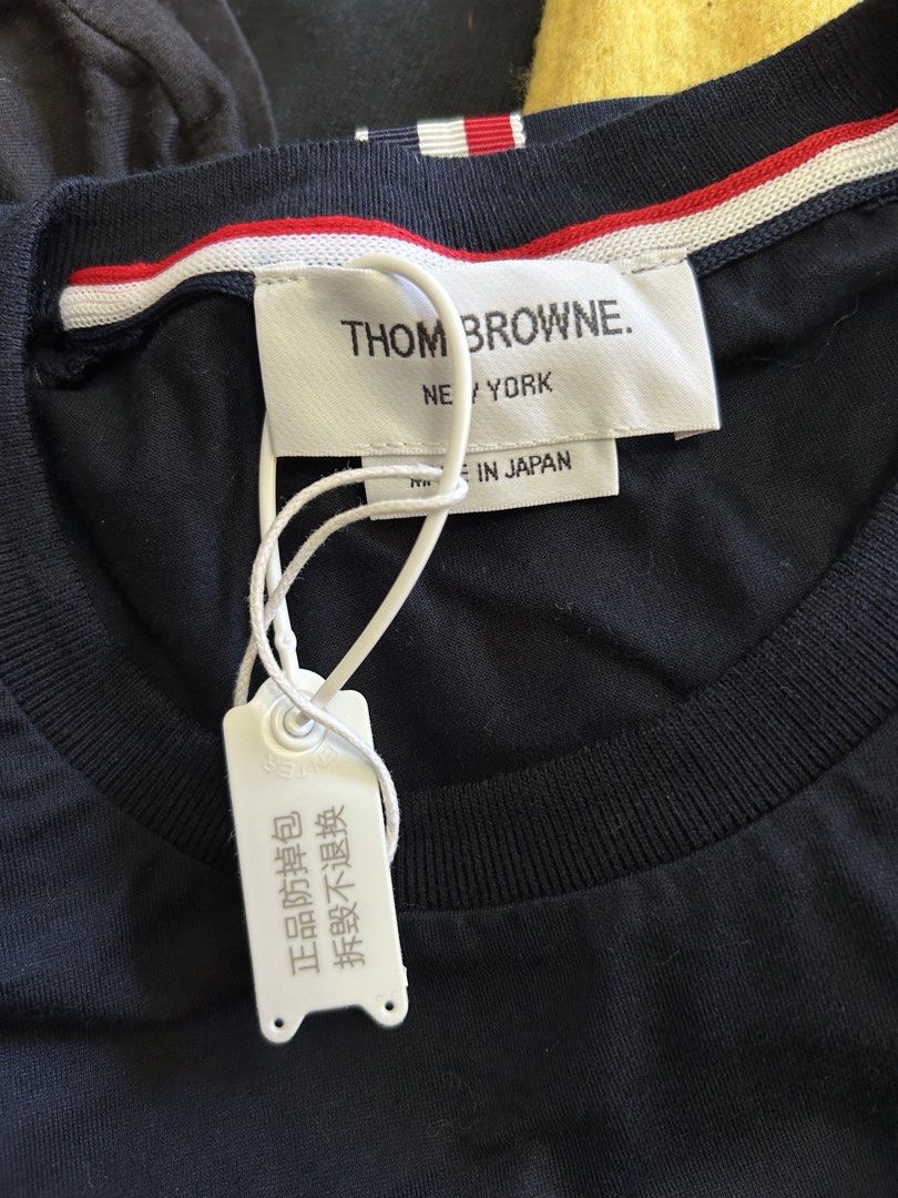 Thom Browne Navy T-shirt Size 2 (Category: Tshirts & Polo Shirts ) located in Bacolod City. Submitted by gilbertgon94115 (Listing ID 1470789880, Image 3). Description: - Brand: Thom Browne - Condition: Brand new with tags attached - Color: Dark Navy Blue - Size: 2 (Medium) - Dimes 19.5 x 25.5 / 27 - Material: 100% premium cotton - Design Details: Signature tricolor (red, white, blue) side panels with mesh gusset vents - Neckline: Classic crewneck