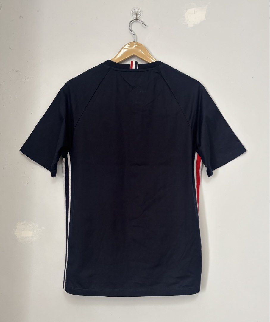 Thom Browne Navy T-shirt Size 2 (Category: Tshirts & Polo Shirts ) located in Bacolod City. Submitted by gilbertgon94115 (Listing ID 1470789880, Image 2). Description: - Brand: Thom Browne - Condition: Brand new with tags attached - Color: Dark Navy Blue - Size: 2 (Medium) - Dimes 19.5 x 25.5 / 27 - Material: 100% premium cotton - Design Details: Signature tricolor (red, white, blue) side panels with mesh gusset vents - Neckline: Classic crewneck