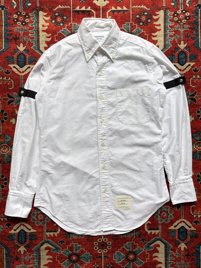 THOM BROWNE Oxford Armband Shirt (Category: Formal Shirts) located in Dagupan City. Submitted by anyklasiko (Listing ID 1470827697, Image 1). Description: THOM BROWNE Oxford Armband Shirt Size: 0 Width: 19.5’ Length: 29’ Shoulder: 16.5’ Sleeve: 23.5 Price: 10499 .