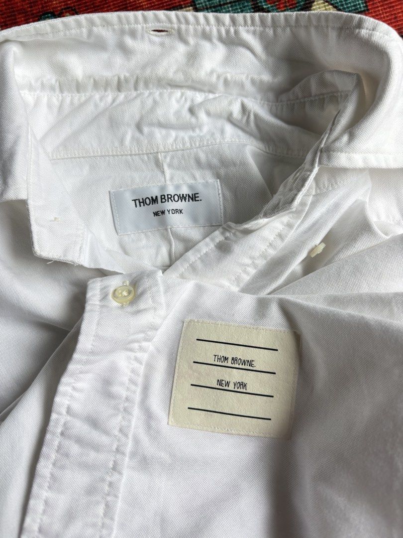 THOM BROWNE Oxford Armband Shirt (Category: Formal Shirts) located in Dagupan City. Submitted by anyklasiko (Listing ID 1470827697, Image 3). Description: THOM BROWNE Oxford Armband Shirt Size: 0 Width: 19.5’ Length: 29’ Shoulder: 16.5’ Sleeve: 23.5 Price: 10499 .